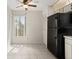 Eat-in kitchen features tile floors, ceiling fan and access to the exterior at 160 Limewood Pl # 1, Ormond Beach, FL 32174