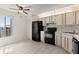 Bright kitchen featuring tile floors, a window, and essential appliances with ample cabinet space at 160 Limewood Pl # 1, Ormond Beach, FL 32174