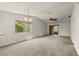 Bright living room with high ceilings, ceiling fan and ample natural light at 160 Limewood Pl # 1, Ormond Beach, FL 32174