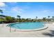 Community pool featuring clear water, landscaping, and lounge seating at 160 Limewood Pl # 1, Ormond Beach, FL 32174