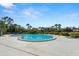 This is a large community pool, with seating, surrounded by landscaping and residences at 160 Limewood Pl # 1, Ormond Beach, FL 32174