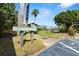 Sign for 160 Limewood, with a view of the lake at 160 Limewood Pl # 1, Ormond Beach, FL 32174