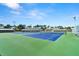 A beautiful community tennis court surrounded by landscaping and residences at 160 Limewood Pl # 1, Ormond Beach, FL 32174