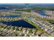 Community aerial view with ponds and sports complex; subject property indicated by a blue arrow at 1750 Savannah Ln, Port Orange, FL 32128