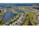Community aerial view with ponds; subject property indicated by a blue arrow at 1750 Savannah Ln, Port Orange, FL 32128