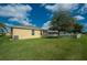 Backyard with a large manicured lawn at 1750 Savannah Ln, Port Orange, FL 32128