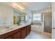 Elegant bathroom with double vanity, soaking tub, and separate glass shower at 1750 Savannah Ln, Port Orange, FL 32128