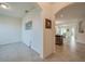 Bright hallway with tile flooring leading to an open-concept living area and kitchen at 1750 Savannah Ln, Port Orange, FL 32128