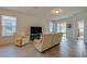 Spacious living room with neutral tones, large windows, and tile flooring at 1750 Savannah Ln, Port Orange, FL 32128