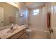 Bathroom featuring a tub, vanity, floral wallpaper, and essential fixtures that provides a functional space at 1983 Stacey Cir, Deltona, FL 32738