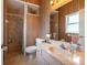 Cozy bathroom with step-in shower, tile flooring, vanity, and a mirror adding style and functionality at 1983 Stacey Cir, Deltona, FL 32738