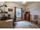 Bedroom with a vintage feel is staged as an office and features wood accents and a window at 1983 Stacey Cir, Deltona, FL 32738