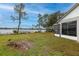 Scenic view of the lake from the property's backyard, offering tranquility and natural beauty at 1983 Stacey Cir, Deltona, FL 32738