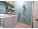 Laundry room with washer, dryer, shelves, and storage at 1983 Stacey Cir, Deltona, FL 32738