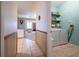 Convenient laundry room with washer, dryer, and storage shelves at 1983 Stacey Cir, Deltona, FL 32738
