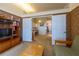 Open living area transitioning to an office, featuring classic vintage-style wallpaper at 1983 Stacey Cir, Deltona, FL 32738