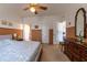 Bedroom featuring carpeted floors, an ample closet, and a neutral color scheme promoting relaxation and rest at 1983 Stacey Cir, Deltona, FL 32738