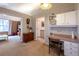 Traditional office space with built-in desk, shelving, and charming vintage wallpaper at 1983 Stacey Cir, Deltona, FL 32738