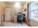 This home office has neutral walls, a built-in desk, and a beautiful window view at 1983 Stacey Cir, Deltona, FL 32738