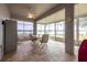 Charming sunroom with tile flooring, ceiling fan, and beautiful waterfront views at 1983 Stacey Cir, Deltona, FL 32738