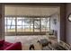 Bright sunroom featuring tile floors, fan, and views of the peaceful lake at 1983 Stacey Cir, Deltona, FL 32738