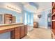 Bright bathroom featuring a soaking tub, dual vanities, and a large framed mirror at 20 Promenade At Lionspaw, Daytona Beach, FL 32124