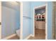 Bathroom area showing toilet and doorway into custom designed closet with ample storage at 20 Promenade At Lionspaw, Daytona Beach, FL 32124