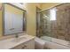 Well-lit bathroom featuring a glass-enclosed shower and a single sink vanity with a large framed mirror at 20 Promenade At Lionspaw, Daytona Beach, FL 32124