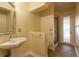 Bathroom with pedestal sink, shower with glass door, and neutral color scheme at 20 Promenade At Lionspaw, Daytona Beach, FL 32124