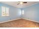 Spacious bedroom with two windows for natural light, carpet, and a ceiling fan at 20 Promenade At Lionspaw, Daytona Beach, FL 32124