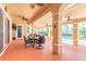 Inviting covered patio with ceiling fans, perfect for outdoor dining and relaxation overlooking the pool at 20 Promenade At Lionspaw, Daytona Beach, FL 32124