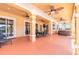 Inviting covered patio with ceiling fans, perfect for outdoor dining and relaxation overlooking the pool at 20 Promenade At Lionspaw, Daytona Beach, FL 32124