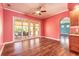 Bright dining room features hardwood floors, view to patio, and access to the kitchen at 20 Promenade At Lionspaw, Daytona Beach, FL 32124