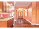Welcoming entryway with wood floors, custom wet-bar, arched entryways, and double front doors at 20 Promenade At Lionspaw, Daytona Beach, FL 32124