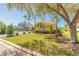 Beautiful yellow home surrounded by mature palms and well-maintained landscaping at 20 Promenade At Lionspaw, Daytona Beach, FL 32124