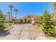 Charming two-story home with a stamped concrete driveway, mature palms and manicured landscaping at 20 Promenade At Lionspaw, Daytona Beach, FL 32124