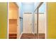 Hallway with tile flooring, closet with sliding mirror doors, and white doors at 20 Promenade At Lionspaw, Daytona Beach, FL 32124