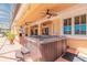 Covered hot tub on a patio surrounded by lush landscaping and a golf course view at 20 Promenade At Lionspaw, Daytona Beach, FL 32124