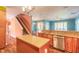 Open-concept kitchen boasts stainless appliances and a view to the staircase and living room at 20 Promenade At Lionspaw, Daytona Beach, FL 32124