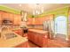 Bright kitchen features stainless appliances, granite countertops, central island, and custom tile backsplash at 20 Promenade At Lionspaw, Daytona Beach, FL 32124