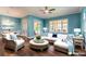 Cozy living room with stylish wicker furniture, modern decor, and lots of natural light at 20 Promenade At Lionspaw, Daytona Beach, FL 32124