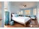 Calming main bedroom with wood floors, large windows, and stylish light blue decor at 20 Promenade At Lionspaw, Daytona Beach, FL 32124