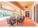 Covered patio featuring ceiling fans, outdoor seating, and a view of the pool and golf course at 20 Promenade At Lionspaw, Daytona Beach, FL 32124