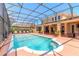 Sparkling screened-in pool with elegant water features and ample space for lounging and entertaining at 20 Promenade At Lionspaw, Daytona Beach, FL 32124