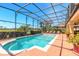 Screened in pool with a fountain, lounge chairs, and view of the golf course at 20 Promenade At Lionspaw, Daytona Beach, FL 32124