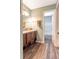Bathroom featuring a wooden vanity with drawers and cabinets, as well as a shower-tub combo at 2057 Hillview Circle, Deltona, FL 32738