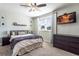 Cozy bedroom with a large window providing natural light and a television for entertainment at 2057 Hillview Circle, Deltona, FL 32738