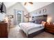 Bedroom features a sloped ceiling, window, and cozy furnishings at 2057 Hillview Circle, Deltona, FL 32738