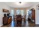 A dining area features a table with seating for four and natural light at 2057 Hillview Circle, Deltona, FL 32738