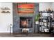 The living room showcases a stone fireplace and a mounted TV at 2057 Hillview Circle, Deltona, FL 32738